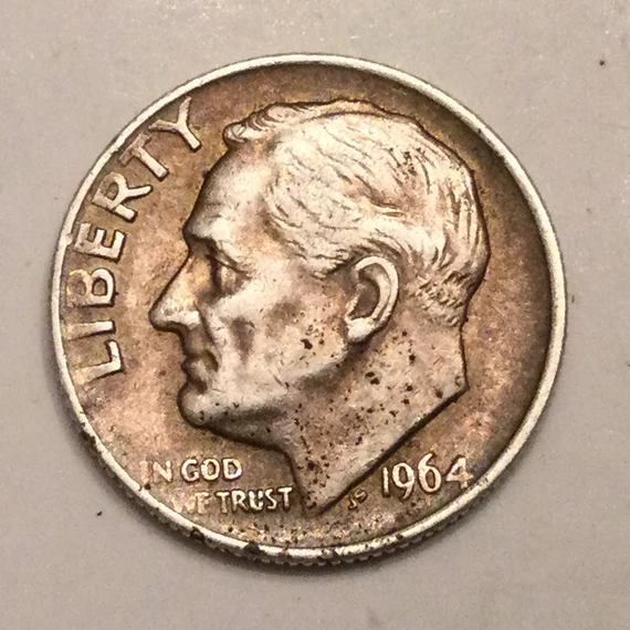 Group of 1964 Roosevelt dimes arranged by condition showing mint facility production era